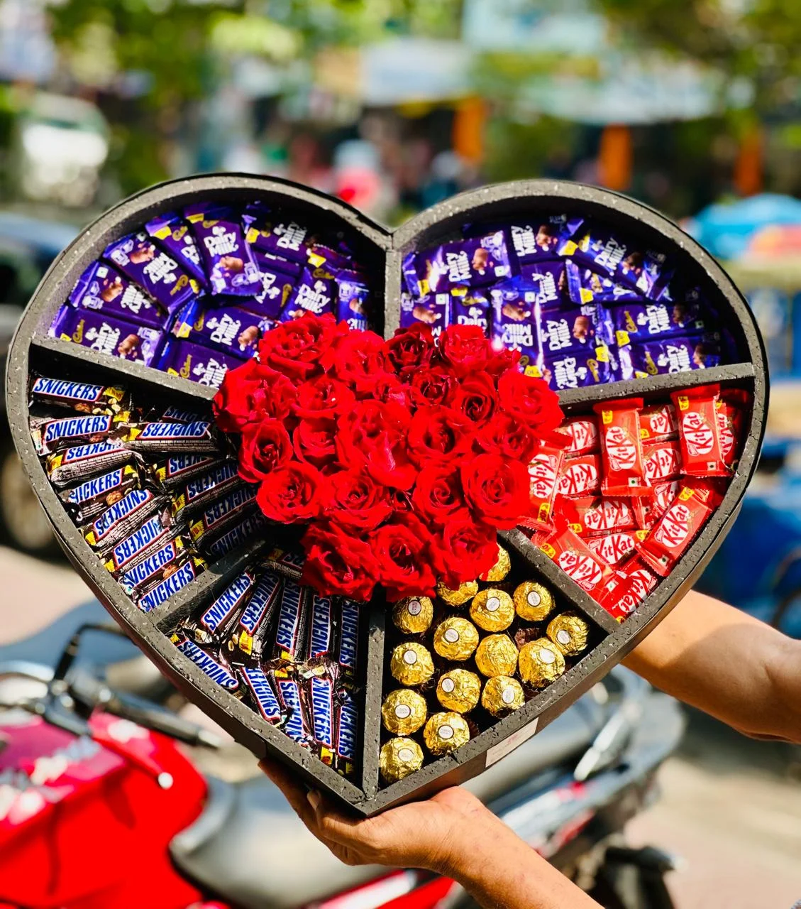 Luxury heart shape chocolate and red rose gift box with Ferrero Rocher, Dairy Milk, KitKat and Snickers by The Gift Heaven