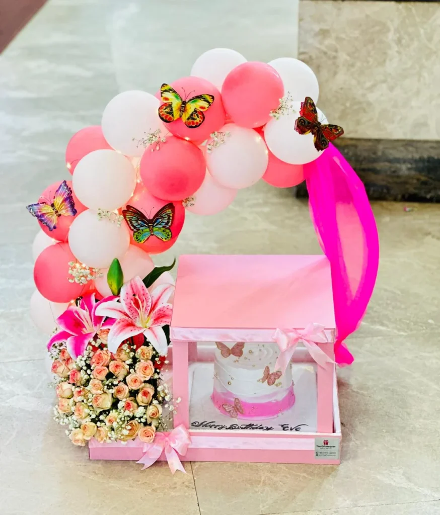 Colorful balloon arch with cake & Flower