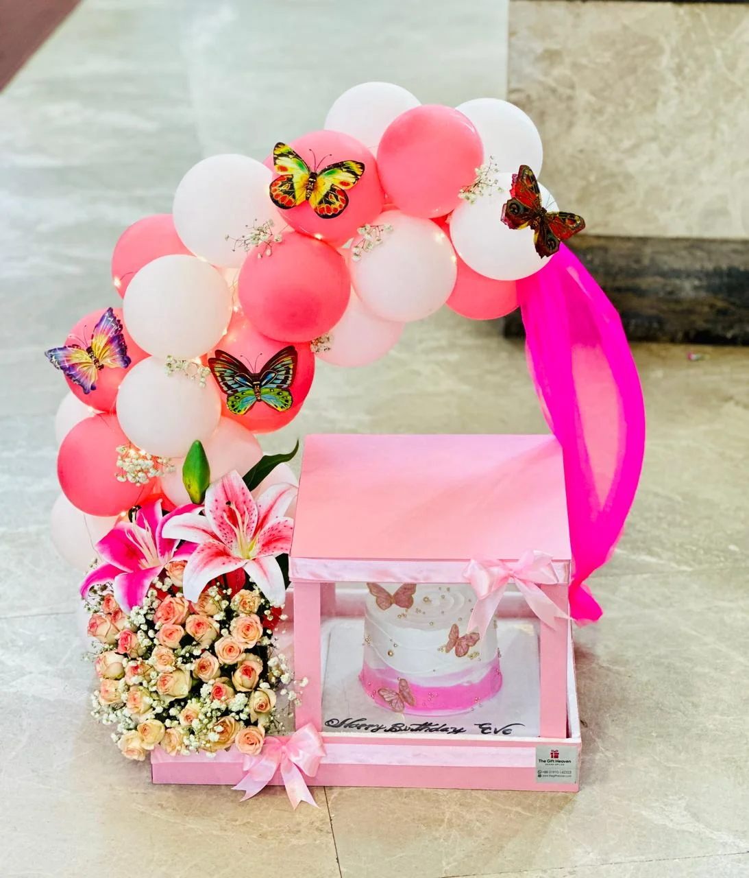 Colorful balloon arch with cake & Flower