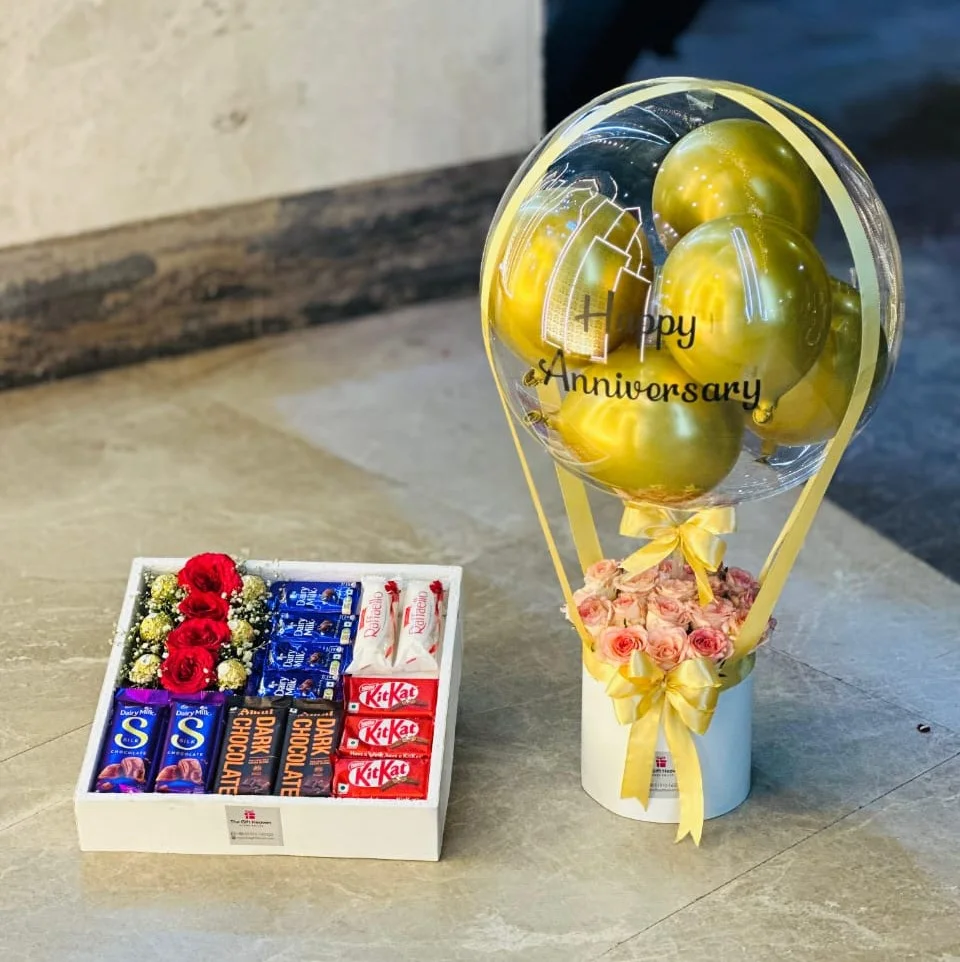 Luxury anniversary gift box with balloon bouquet, red roses and premium chocolates by The Gift Heaven