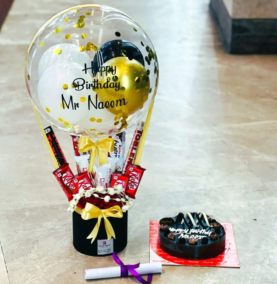 Premium birthday chocolate balloon gift with cake, roses and chocolates by The Gift Heaven