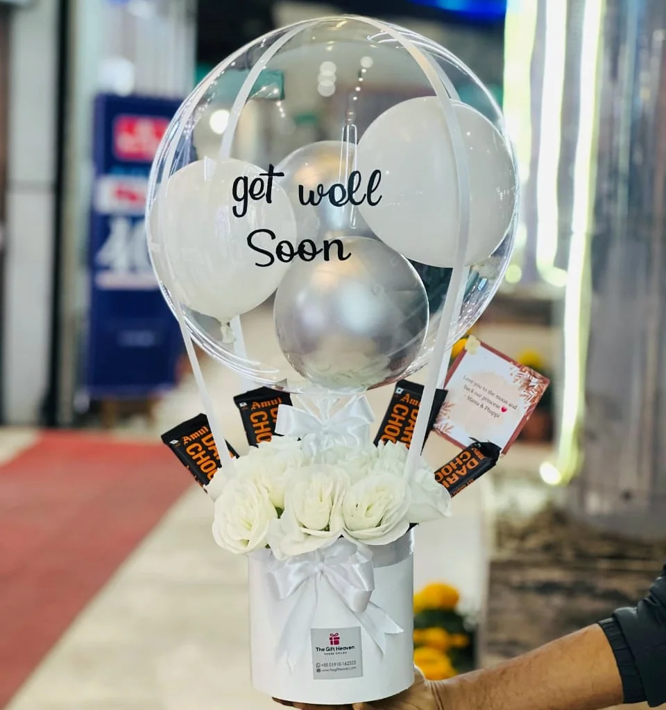 Get well soon balloon bouquet with artificial white roses and chocolate by The Gift Heaven