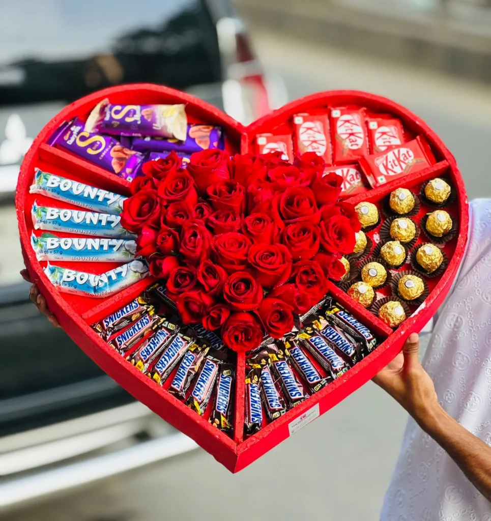 Luxury heart-shaped chocolate and red rose gift box with assorted chocolates for Valentine’s, anniversary, and romantic surprises.