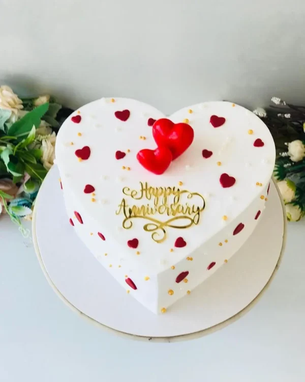 Elegant White Heart-Shaped Love Cake for Special Occasions