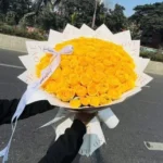 Luxury yellow rose bouquet featuring premium fresh yellow roses beautifully wrapped in elegant white luxury paper, perfect for birthdays, congratulations, friendship, anniversaries, and special occasions in Bangladesh.