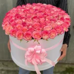 Luxury pink rose flower box with premium round white box and elegant pink ribbon by The Gift Heaven Bangladesh.