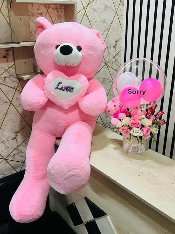 Luxury pink apology gift combo featuring a giant teddy bear, hot air balloon chocolate flower box, mini teddy, premium chocolates, and elegant pink floral arrangement, perfect for saying sorry in Bangladesh.