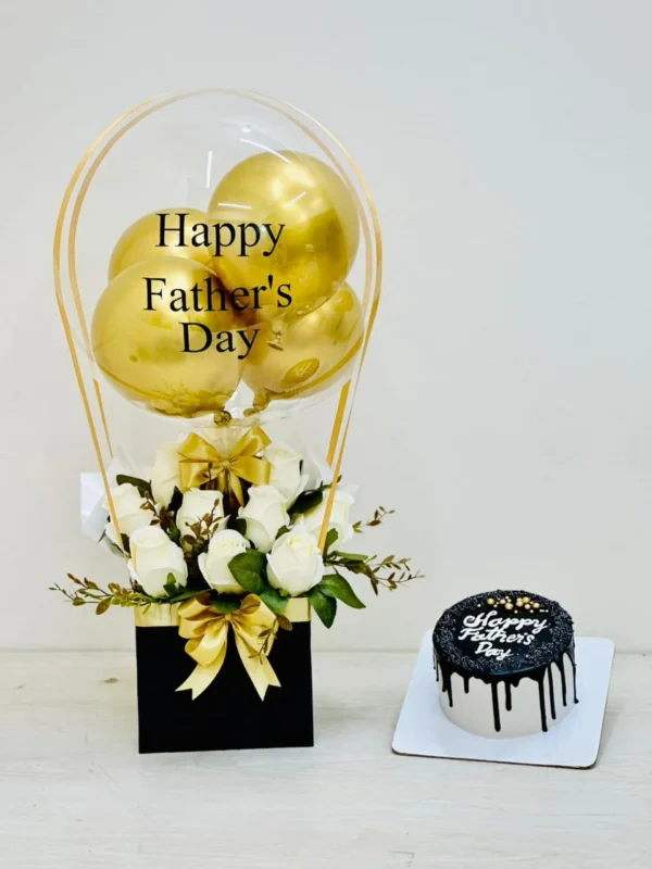 Luxury Happy Father's Day gift set with white roses, gold bubble balloon, elegant floral arrangement, and premium cake by The Gift Heaven Bangladesh