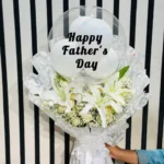 Luxury Happy Father's Day white lily bouquet with balloon and elegant white floral wrapping by The Gift Heaven Bangladesh