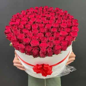 Luxury red rose flower box featuring premium fresh red roses elegantly arranged in a large white round box with a beautiful red satin ribbon, perfect for romantic surprises and special occasions in Bangladesh.
