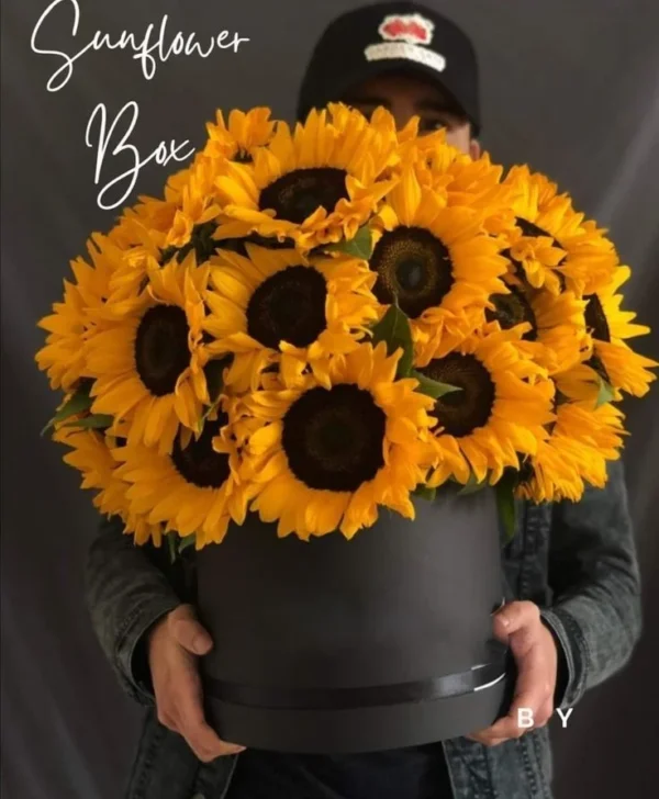 Luxury sunflower flower box featuring premium fresh sunflowers elegantly arranged in a stylish black round gift box, perfect for birthdays, congratulations, anniversaries, and special occasions in Bangladesh.