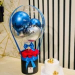 Luxury Happy Birthday Baba gift set with hot air balloon arrangement, fresh red roses, premium white birthday cake, and elegant blue-themed decoration by The Gift Heaven Bangladesh.