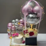 Luxury Happy Birthday cake tray with a wooden and PVC base, premium floral hot air balloon arrangement, elegant birthday cake, personalized balloon, LED balloon decor, and customized balloon arch for birthday surprises in Bangladesh.