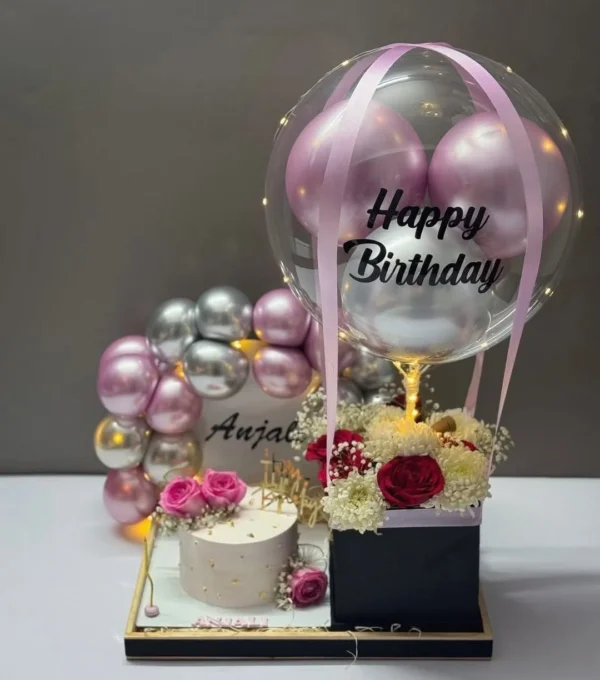 Luxury Happy Birthday cake tray with a wooden and PVC base, premium floral hot air balloon arrangement, elegant birthday cake, personalized balloon, LED balloon decor, and customized balloon arch for birthday surprises in Bangladesh.