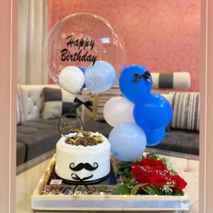 Luxury birthday cake tray with hot air balloon, fresh red rose arrangement, elegant balloon cluster, premium birthday cake, and handcrafted decorative tray by The Gift Heaven Bangladesh.