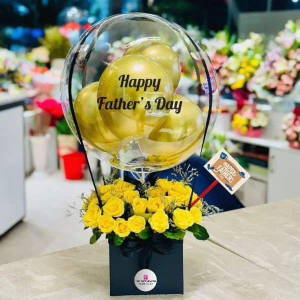 Luxury Father's Day hot air balloon flower box with premium gold balloons, fresh yellow roses, elegant black gift box, and personalized Father's Day decoration by The Gift Heaven Bangladesh.